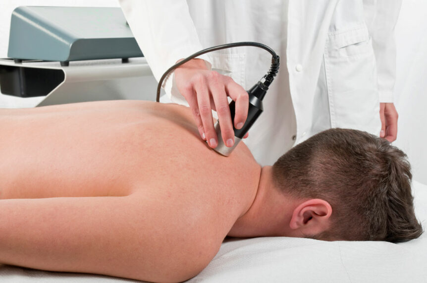 Man Getting Chiropractic Ultrasound - auto accident clinic
